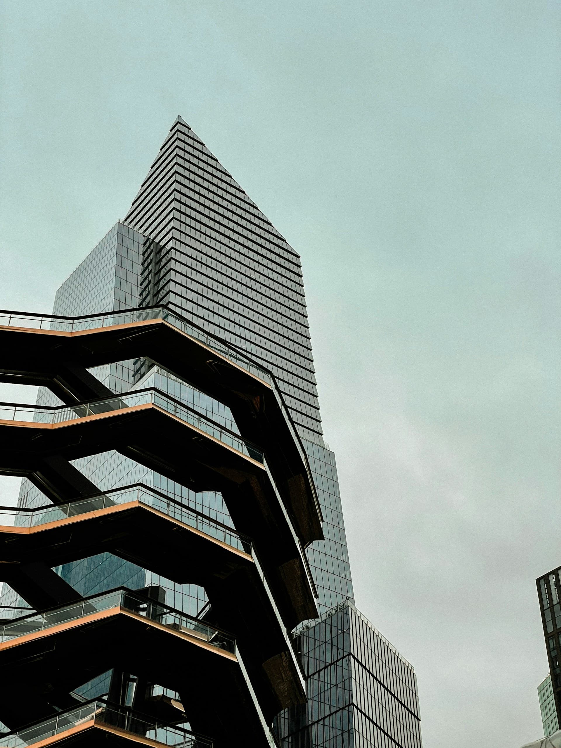 Glass office tower with external staircases