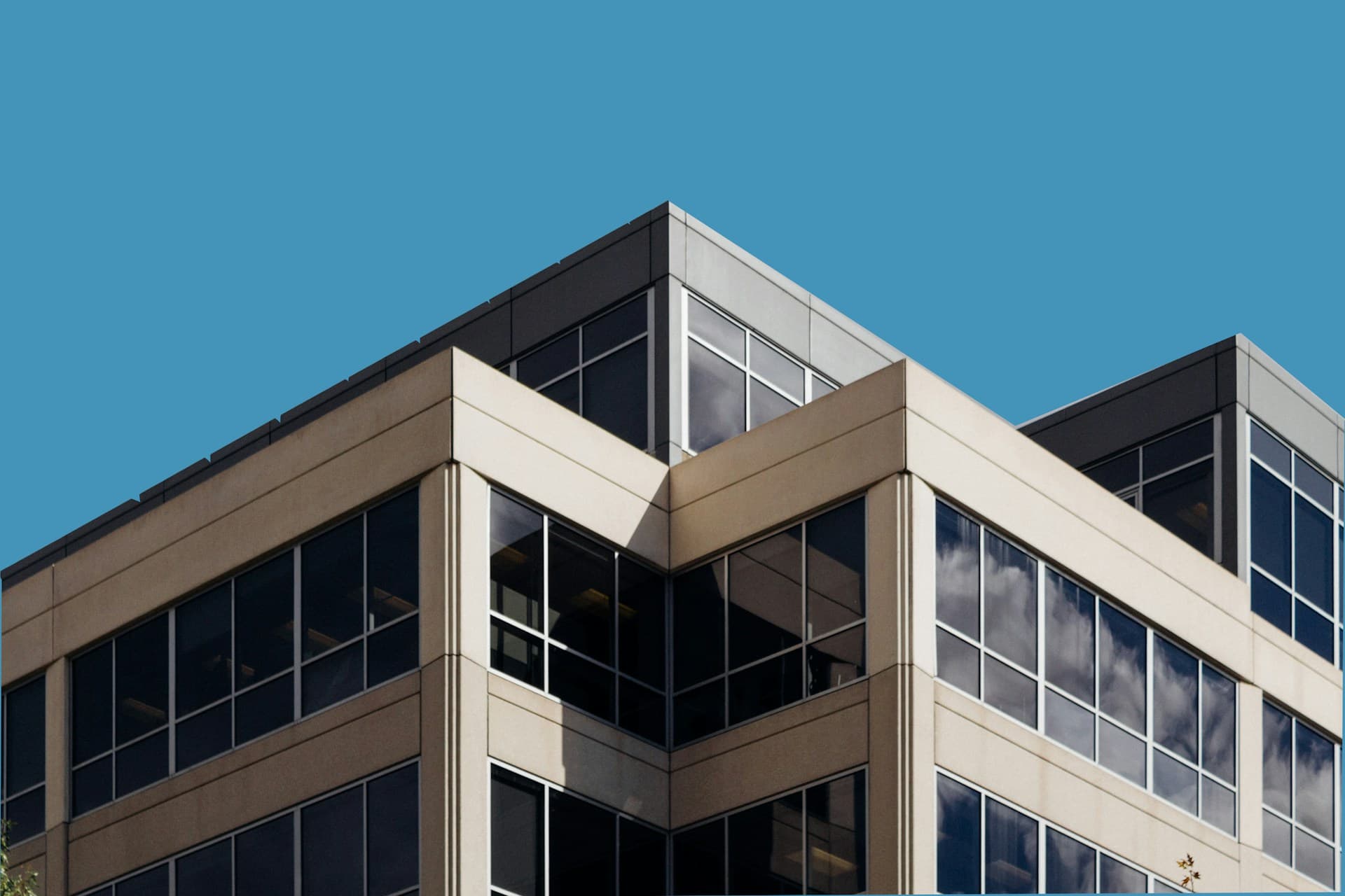 Modern office building against a blue sky
